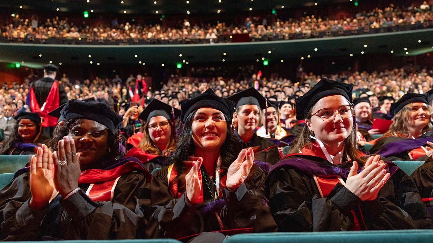 Students applauding at May Commencement